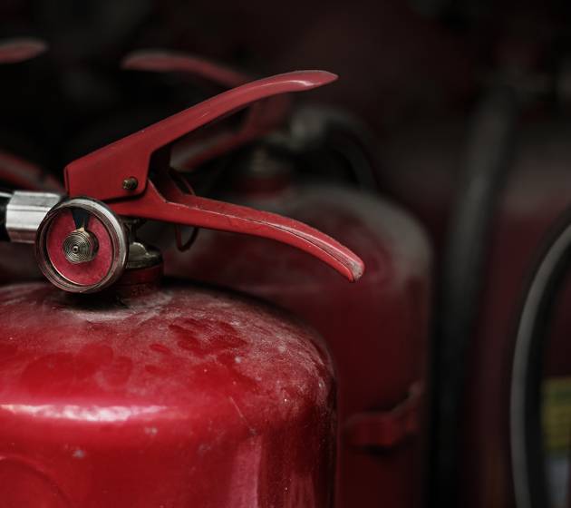 Closeup of red fire extinguishers